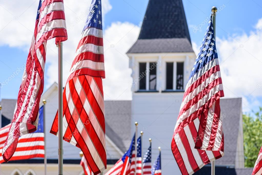 American flags in front of church