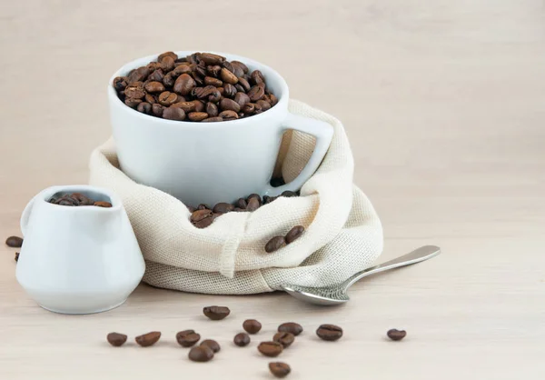 Close Coffee Cup Coffee Beans Silver Spoon Wooden Table — Stock Photo, Image