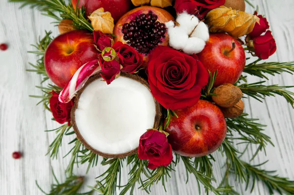 Fruit bouquet  with apples, roses and pomegranate.