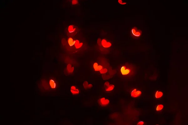 Red hearts bokeh background. Valentines Day, symbol of love. — Stock Photo, Image
