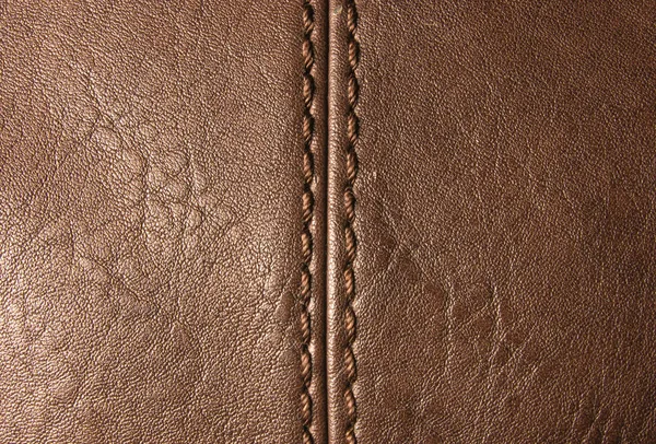 seams on leather hand bag