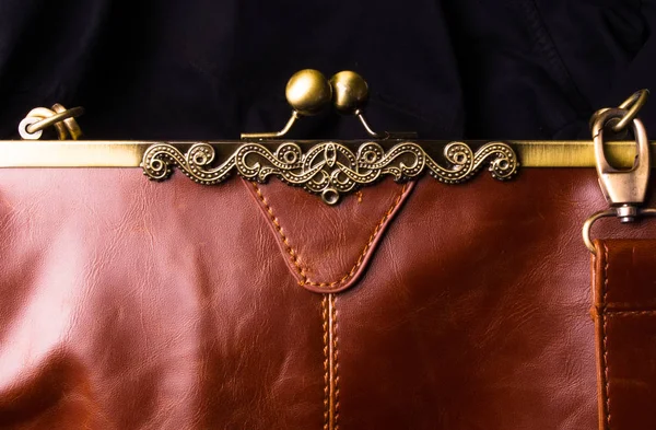 seams on leather hand bag