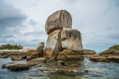 Koh hinson (The great stone) of Lipe island in Satun province of southern Thailand. clipart