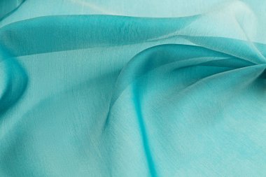 Turkuaz arka plan lüks bez ya da dalgalı ipek doku saten kıvrımları 