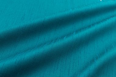 Turkuaz arka plan lüks bez ya da dalgalı ipek doku saten kıvrımları 