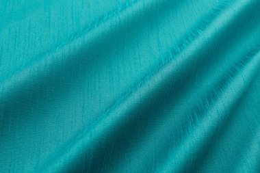 Turkuaz arka plan lüks bez ya da dalgalı ipek doku saten kıvrımları 