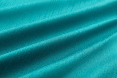 Turkuaz arka plan lüks bez ya da dalgalı ipek doku saten kıvrımları 
