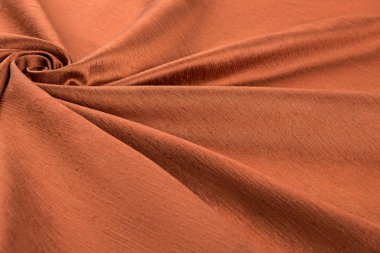 Turuncu arka plana lüks bez ya da dalgalı kıvrımları gibi grunge ipek saten kadife doku