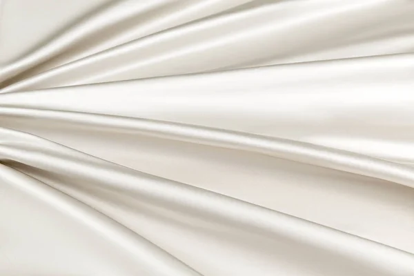 Бежевий фон розкішна тканина або хвилясті складки гранжевої шовкової текстури атласний оксамит — стокове фото