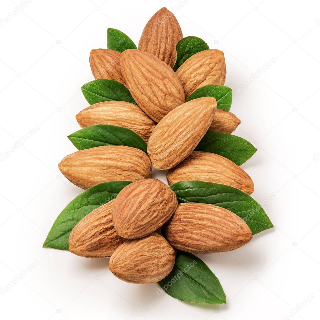 tasty almonds nuts close-up and green leaves, isolated on white background