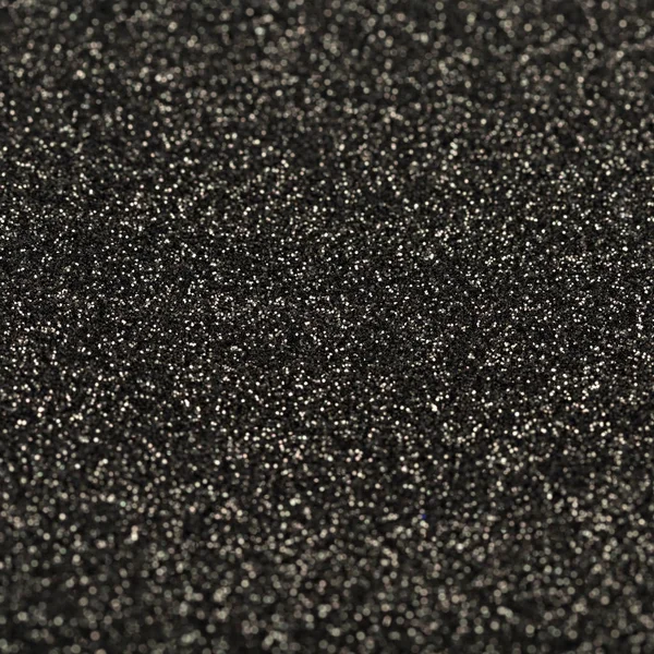 Textura brillante negro, lentejuelas con fondo borroso — Foto de Stock