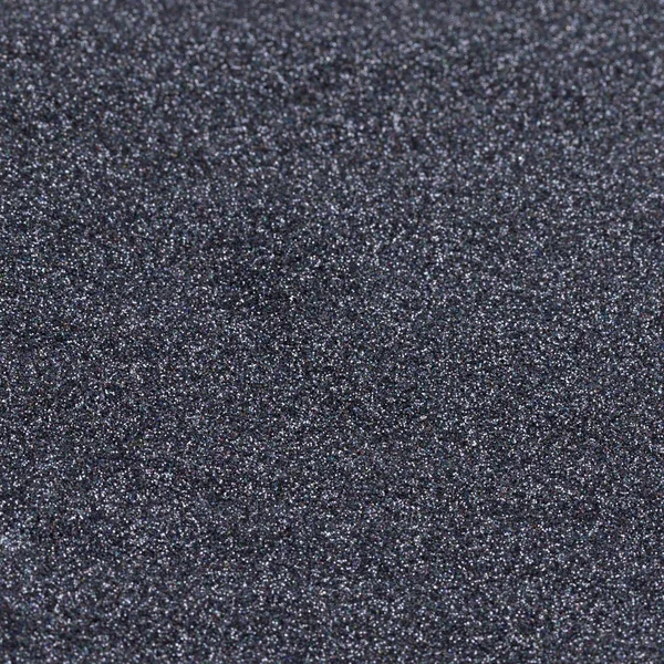 Textura brillante negro, lentejuelas con fondo borroso — Foto de Stock