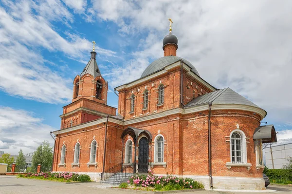 Orthodox or Christian Church of red brick. Beautiful blue sky. Royalty Free Stock Images