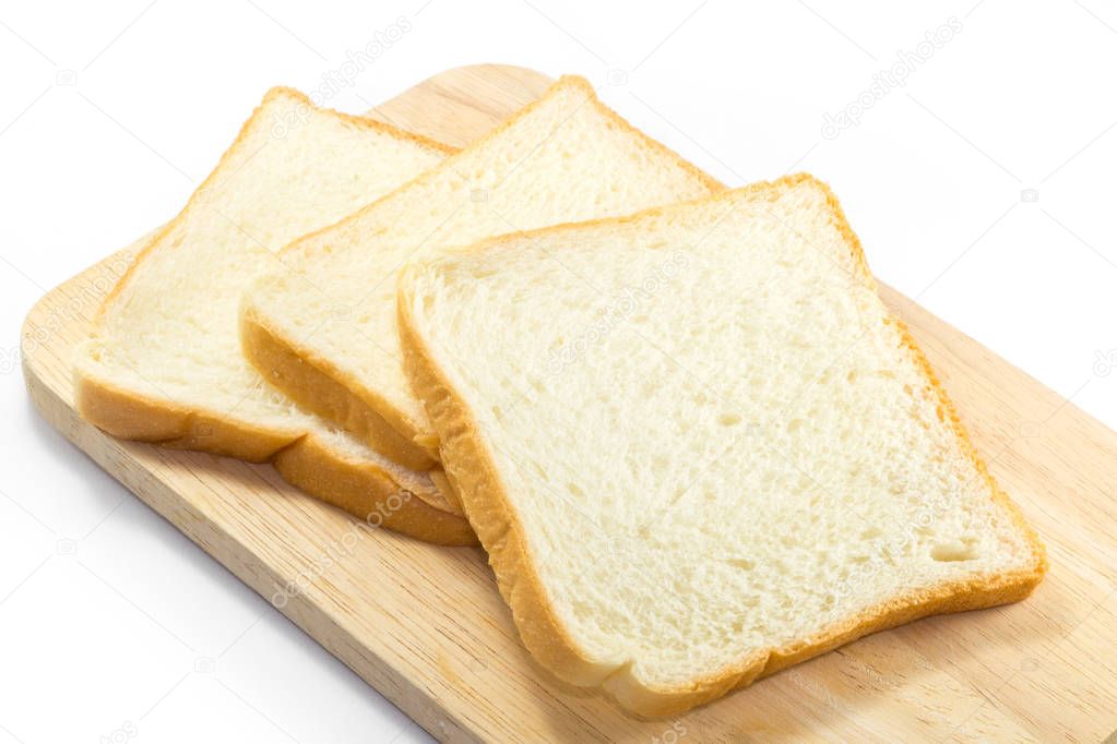 Slices of toast bread on breadboard wooden, isolated on white background