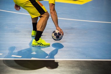Handball player and ball. clipart