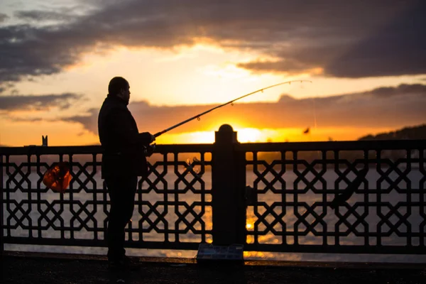 Fisherman on bridge — Stock Photo, Image