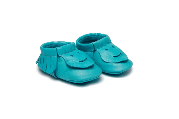 Childs turquoise booties on a white background Royalty Free Stock Images