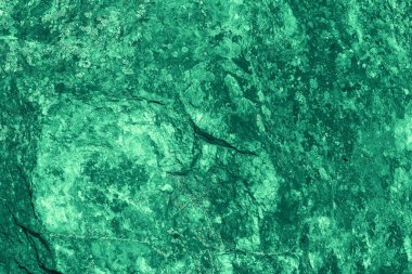 Klasik yeşil arka plan. Zümrüt renginde kaba boyanmış duvar