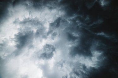 Dramatic cloudscape texture. Dark heavy thunderstorm clouds before rain. Overcast rainy bad weather. Storm warning.