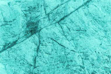 Vintage azure background. Rough painted wall of turquoise color. Imperfect plane of cyan colored. 