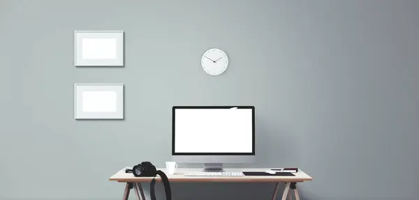 Computer display and office tools on desk