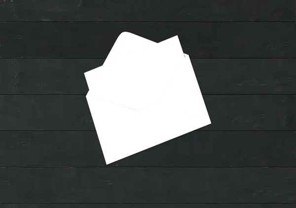 Envelope with blank card. Blank envelope with post card on dark background.