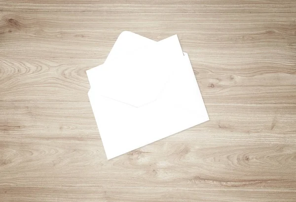Envelope with blank card. Blank envelope with post card on dark background.