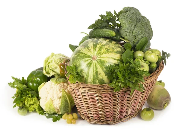 Green vegetables in wicker basket — Stock Photo, Image