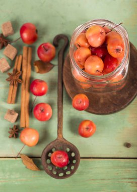 paradise apples, on the wooden table in the rustic style, iron mug clipart