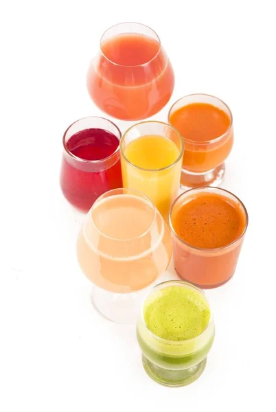 Glasses with fresh organic vegetable and fruit juices isolated on white. — Stock Photo, Image