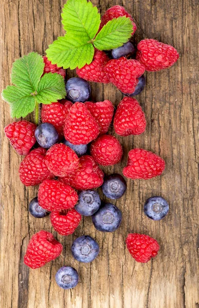 Fresh berries on old wooden — Stock Photo, Image