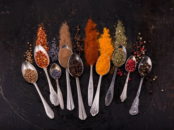 Spices and condiments for cooking on a black background