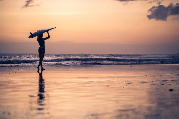 Female surfer with board in hands — Stock Photo, Image