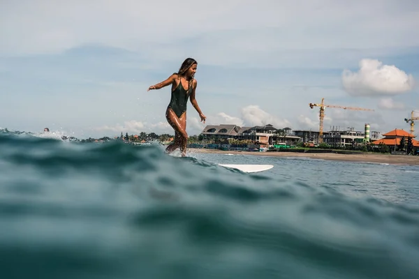 Female surfer on surf board — Stock Photo, Image