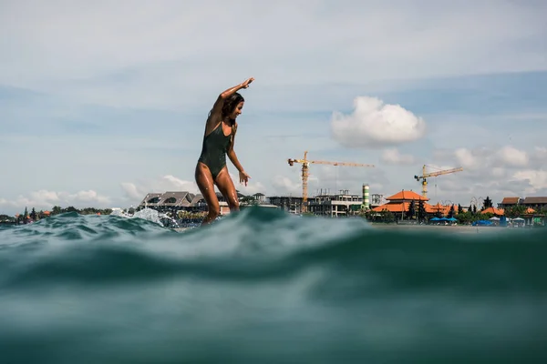 Female surfer on surf board — Stock Photo, Image