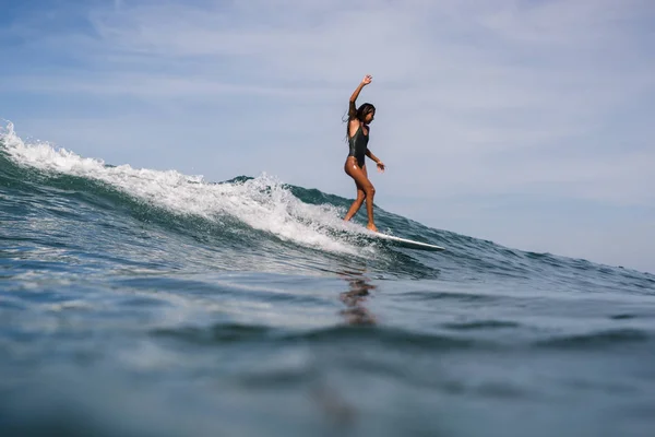 female surfer on surf board