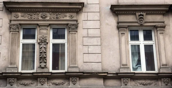 Three vintage design windows on the facade of the old house — Stock Photo, Image