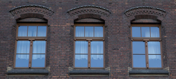 Three vintage front glass windows of an old house