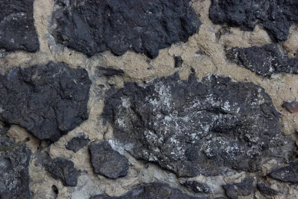 Taş duvar dokusunun soyut arkaplanı