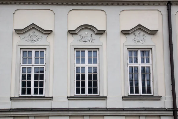 Three vintage design windows on the facade of the old house — Stock Photo, Image