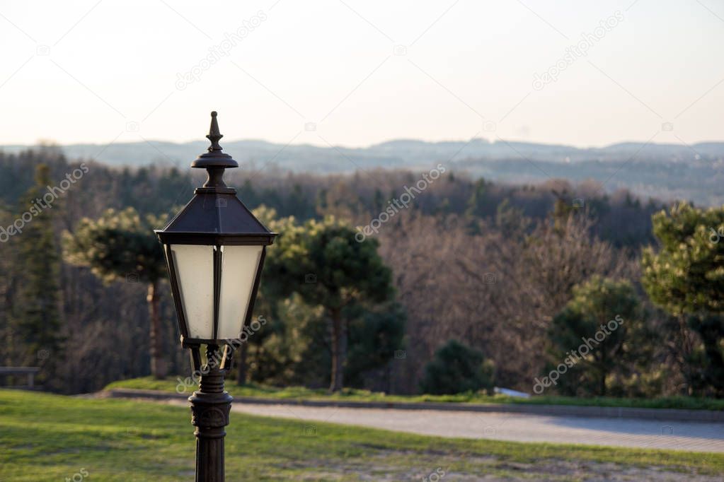 Street lamp on the background of nature and mountains