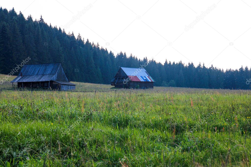 Two wooden hut among the mountains