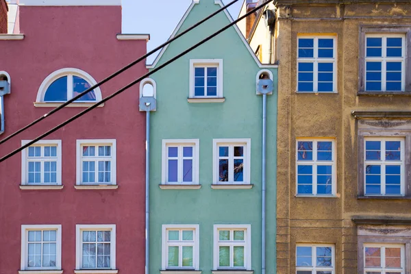 The facades of three vintage colorful houses — Stock Photo, Image
