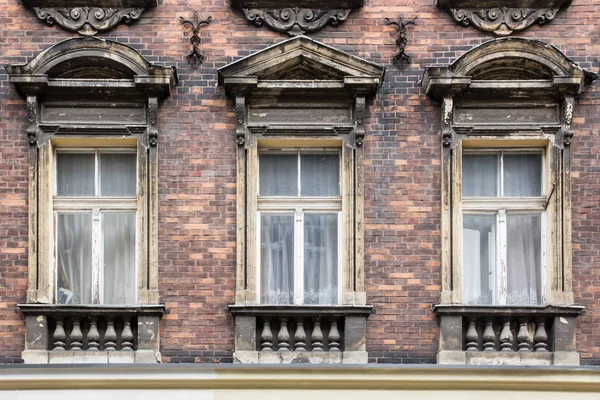 Three vintage Windows on the facade of the old brick house — Stock Photo, Image