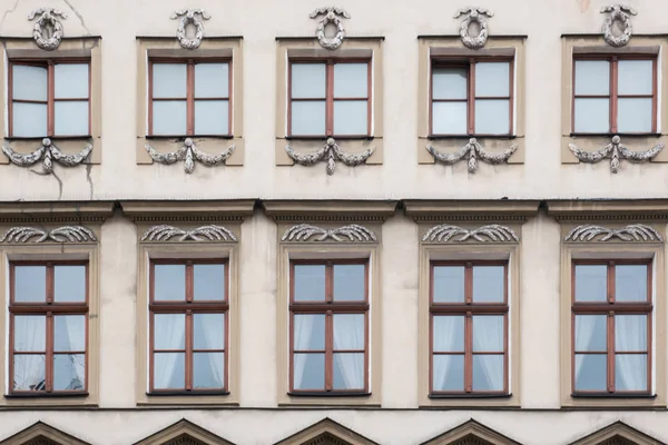 Ten windows on the facade of a vintage house