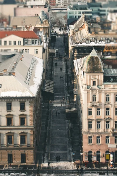 Street view with people walking between the old vintage houses, — Stock Photo, Image