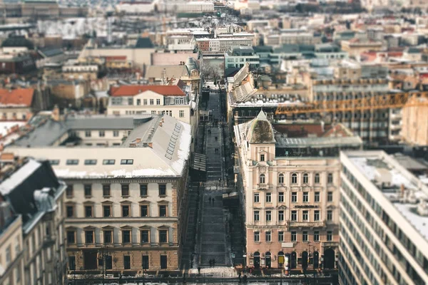 Street view with people walking between the old  houses, tilt-sh — Stock Photo, Image