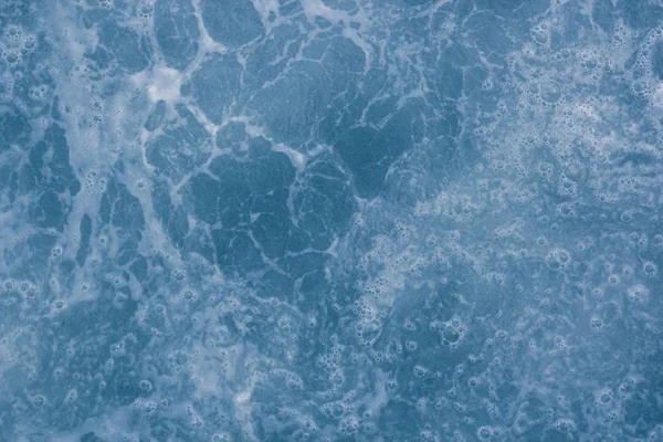 Abstract blue sea water with white foam and bubbles for backgrou — Stock Photo, Image