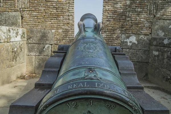 Very old war cannon on the castle wall