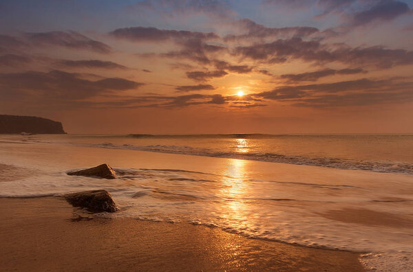Golden hour sunset at cabo ledo beach, angola